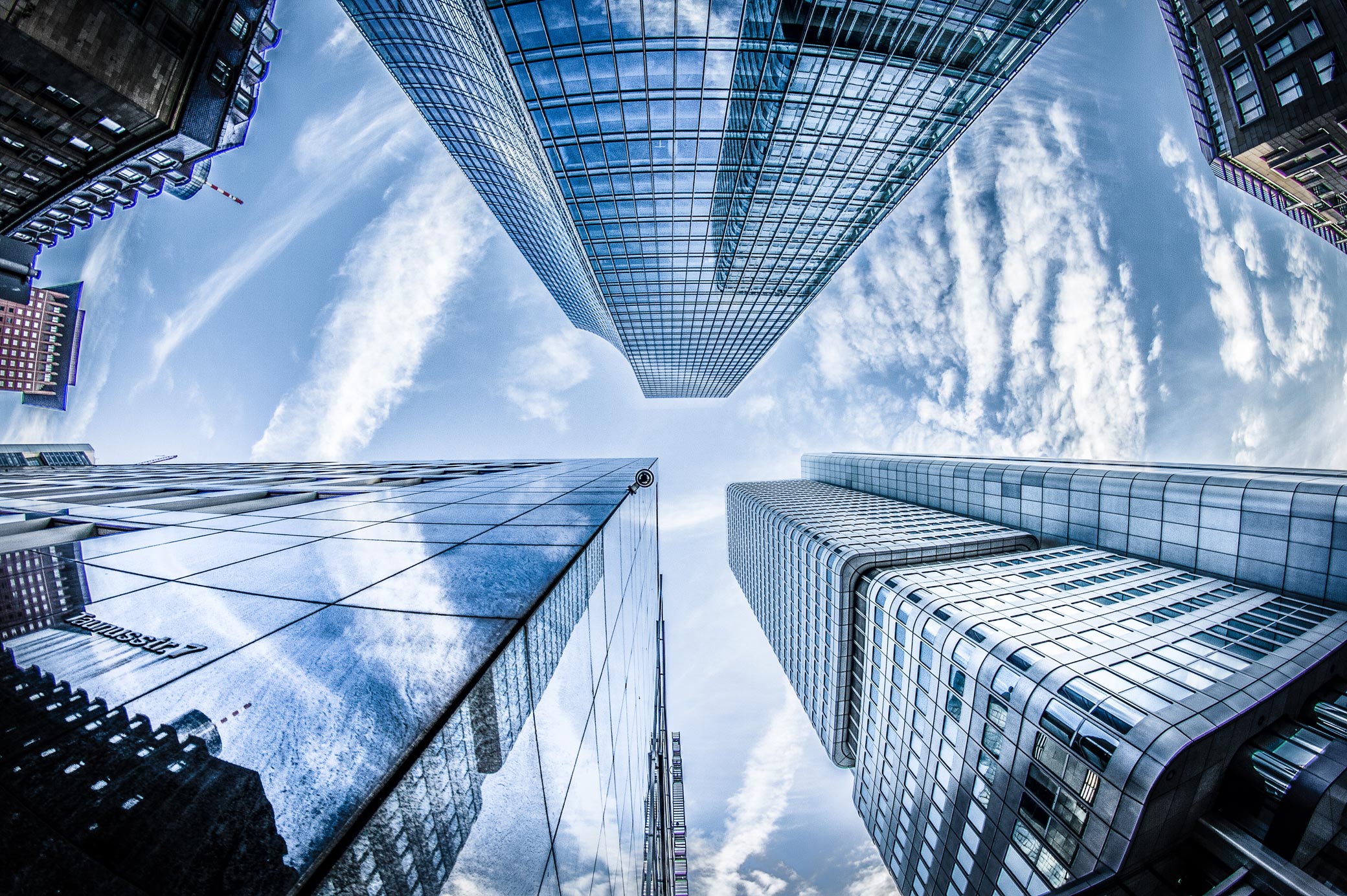 a-low-angle-photo-of-four-high-rise-curtain-wall-buildings-830891