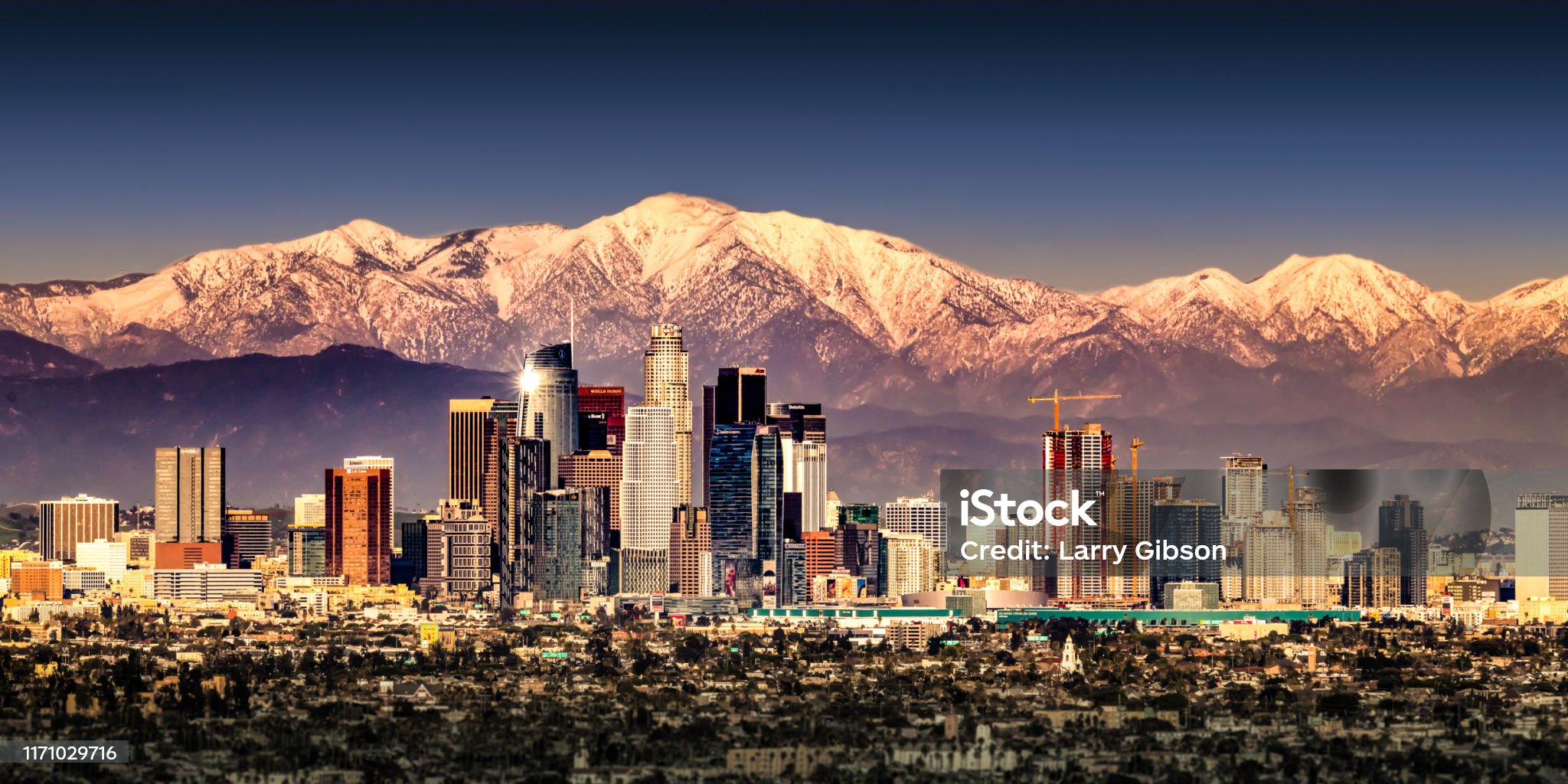 Sunset in Los Angeles with snowcapped mountains